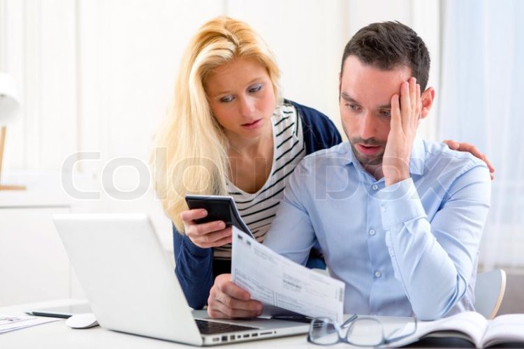12121004-attractive-couple-doing-administrative-paperwork